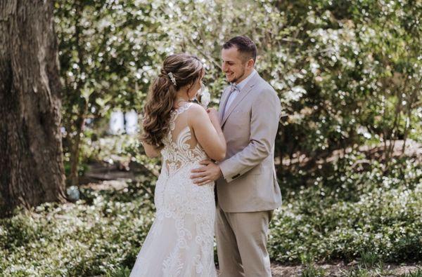 Bride and groom standing in the garden