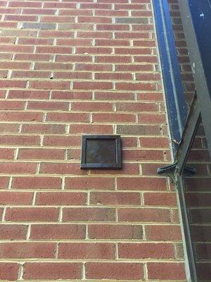 New Dryer Wall Vent Installed on Brick Building