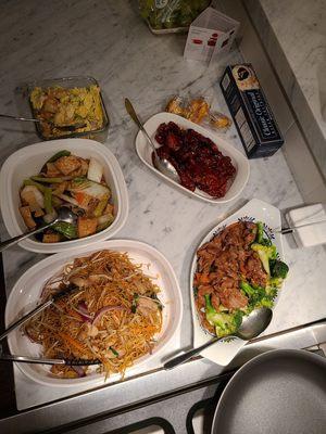 Takeout, bottom left counter-clockwise: chow mein, clay pot, spare ribs, broccoli beef