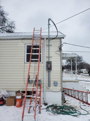 Exterior meter gutter offset mast service replacement.