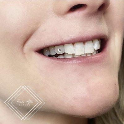 Smile cause you deserve to! Tooth gems are so hot.