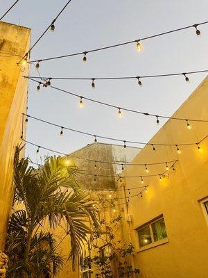 Courtyard looking up as the sun goes down.