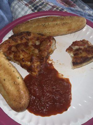 The slices of pizza (there were 4) and the garlic sticks.