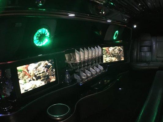 Either limo can display one of the videos we have: aquarium, fireworks, fireplace, sunset, etc. at the same time as the music is playing!