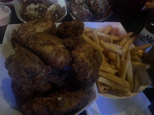 Dry seasoned wings and fries.