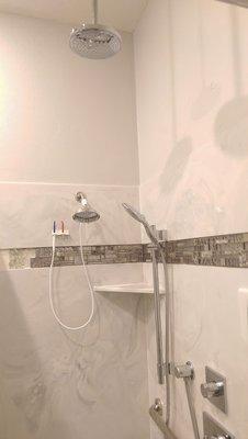 This is a Country Grey cultured marble shower with a glass tile band