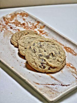 Two chocolate chip and one peanut butter cookies..