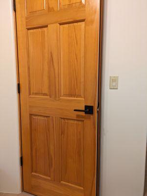 Tony re-finished old pine doors and installed new flat black hardware