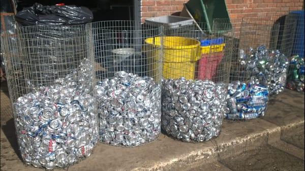 How we collect our lose cans that we purchase before we put them into the crusher to bale them.