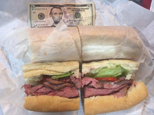 Large roast beef grinder with lettuce, tomatoes, and provolone cheese. No it's not two grinders, it's just one!