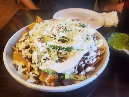 Chicken and beef nachos - ridiculously large. Easily can fill 2 people alone