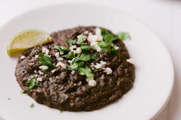 "Refried Beans" - Beluga Lentils with onion, serrano, cotija and cilantro (avail. vegetarian or vegan)