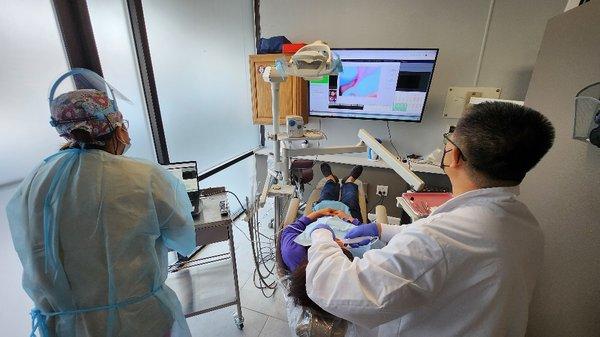 Exam using oral cameras to show our patients their treatment plan.