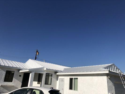 Right side view of the metal roof front of house, completed by Juan