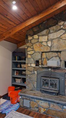 After new chimney - Living with buckets in our living room because every time it rains water is coming in.