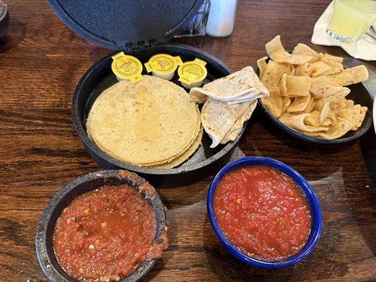 House made corn & flour chips & tortillas, hot and mild salsa.