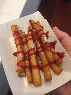 Funnel Cake Fries with raspberry sauce.