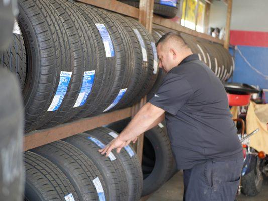 Owner showing his collection of tires