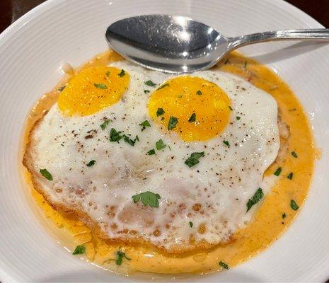 McIntosh Shrimp and Grits with two eggs.