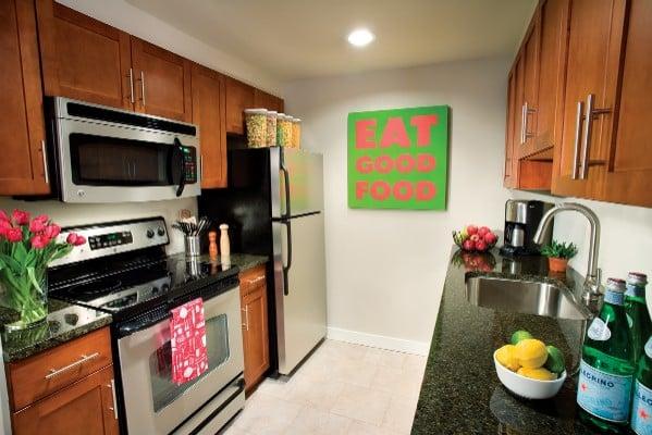 Kitchens feature modern appliances, beautiful ceramic tile floors, and granite counter tops