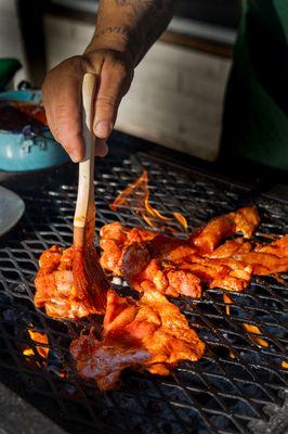 Pollo A Las Brasas being cooked on our Santa Maria grill.