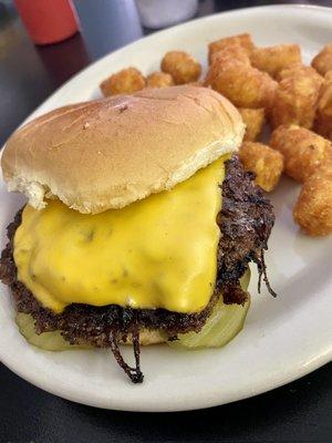 Original Charley Burger - grilled thin & crisp, caramelized onions grilled in the patty, mustard & dill pickles w/ tots