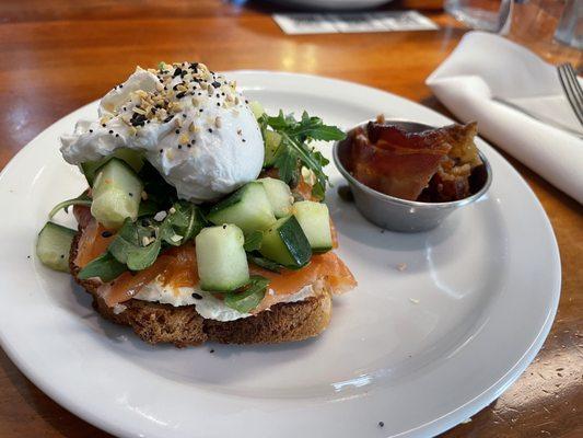 Avocado toast with egg and a side of bacon