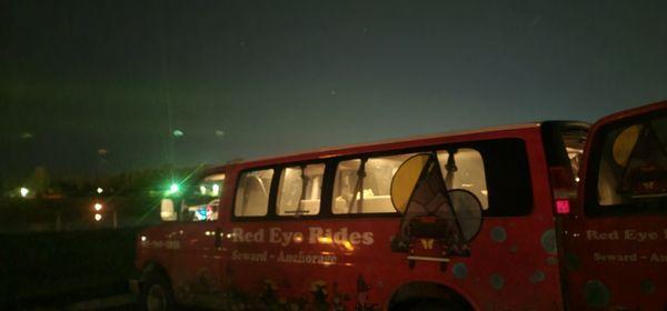 Red Eye Rides is waiting on a late night flight watching bans of Auroras in the cell phone lot. Lake Hood 
September 2023 - Photo by Angel