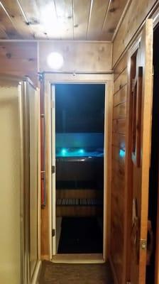 View from the sauna building to the fenced in outside hot tub. Rental includes the use of the building. Sauna is separate rental fee.