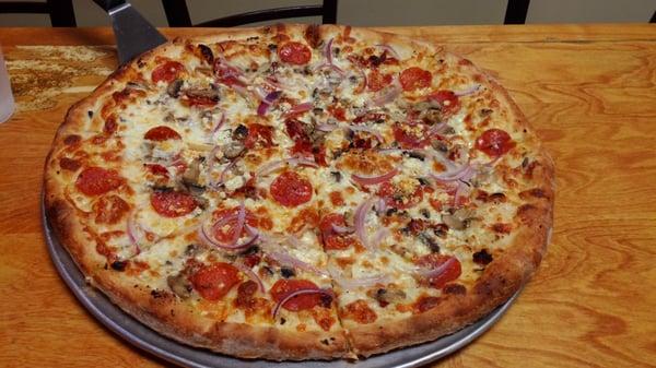 18" New York-er (garlic sauce, mozzarella cheese, sun dried tomatoes, pepperoni, mushrooms, onions and feta cheese)