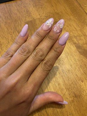 Almond shaped gel full set French/solid combo with flower detail, two colors.