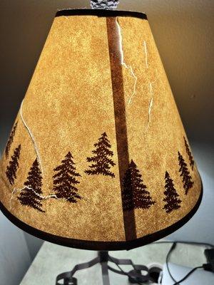 Badly cracked lampshade. Not rustic. Cracked.