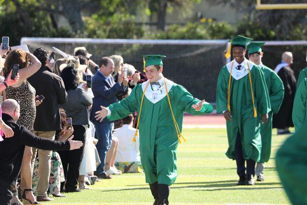 Student celebrating at graduation.