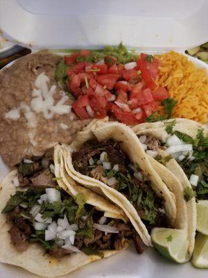 Combo platter with carne asada tacos.