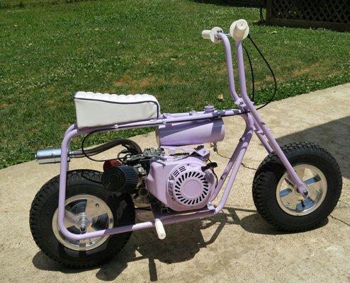 Madison's mini bike. Custom Lavender Sparkle powder coat. Custom gas tank, engine mods and exhaust. Custom seat by Rod's.