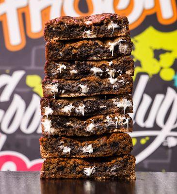 Thick chocolate and marshmallow cookie stack by Cookie Plug. Try our bomb AF smores cookie recipe!