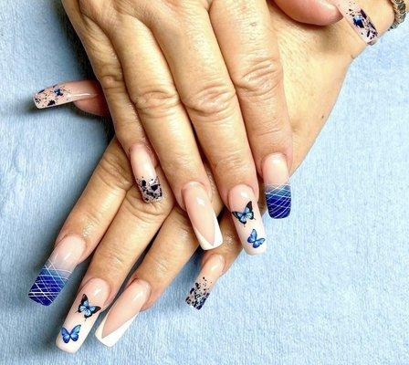 Acrylic nails with a butterfly design