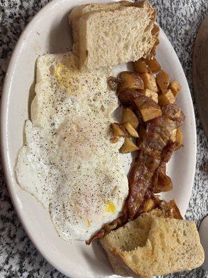 3 Eggs, crispy home fries, bacon, & home made toast