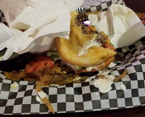 Half eaten bulldog burger