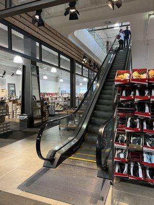 Escalator to the upstairs. This location is so big it has two levels