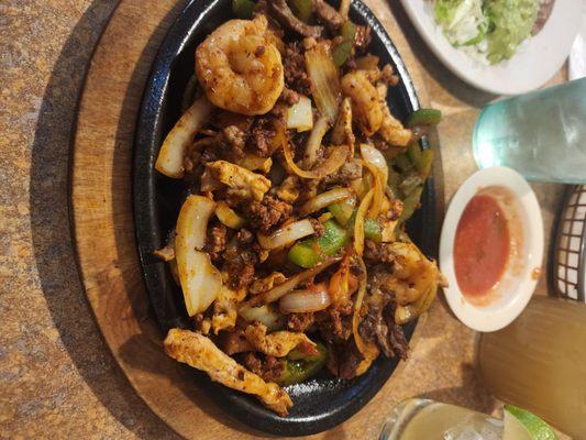 Chicken, Shrimp, Steak, and Chorizo with onions and green peppers fajita