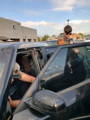 Thieves loading unpaid groceries in the car.