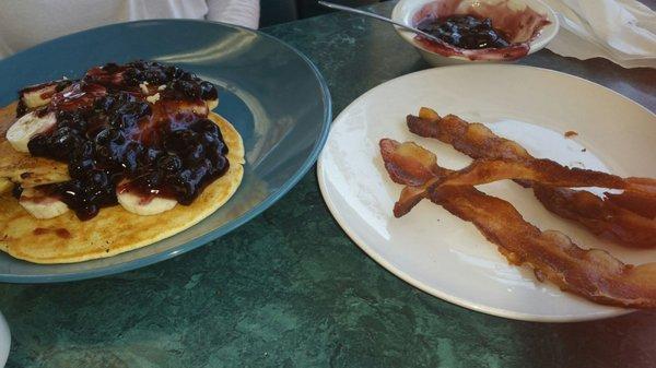 Banana/blueberry pancakes and side of bacon.