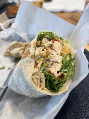 Half of the chicken caesar salad wrap (minus tomatoes)! Delicious!