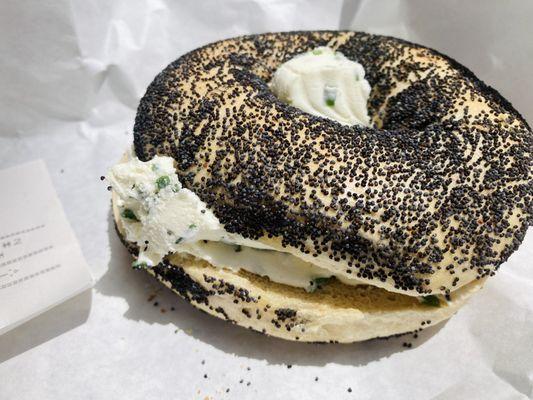 Poppy seed bagel with chive cream cheese.