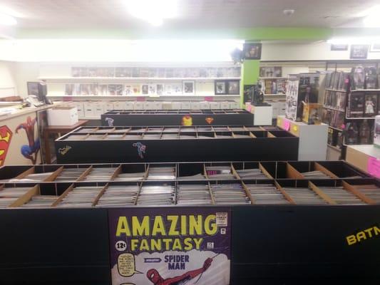 Our loose comic bins with white boxes lining the walls. All loose comics without bags and boards in this section are only $1 a piece!