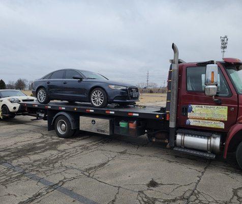 Flat bed tow truck.  Call for Estimate!