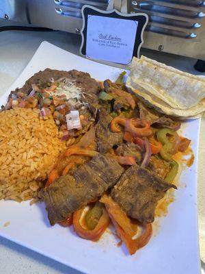 Steak Ranchero with a side of 4 corn tortillas