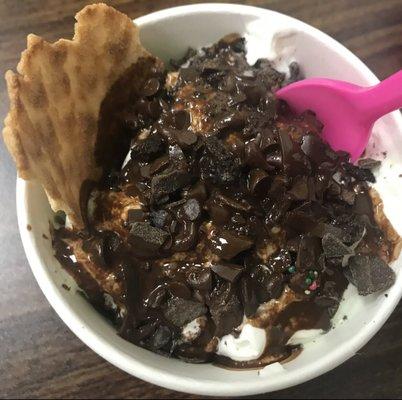 Mint Chocolate Chip frozen yogurt, waffle, whip cream, hard hat, hot fudge, Andes Chocolate Mints, crushed Oreos & many chocolate pieces!