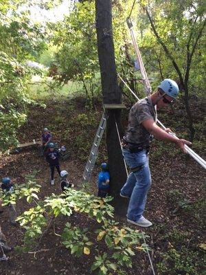 Crossing the Postman's Walk at the Randallstown Ropes Course.